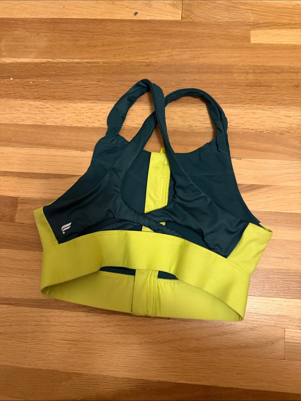 Fabletics Two-Tone Front-Zip Sports Bra in Black and Mustard